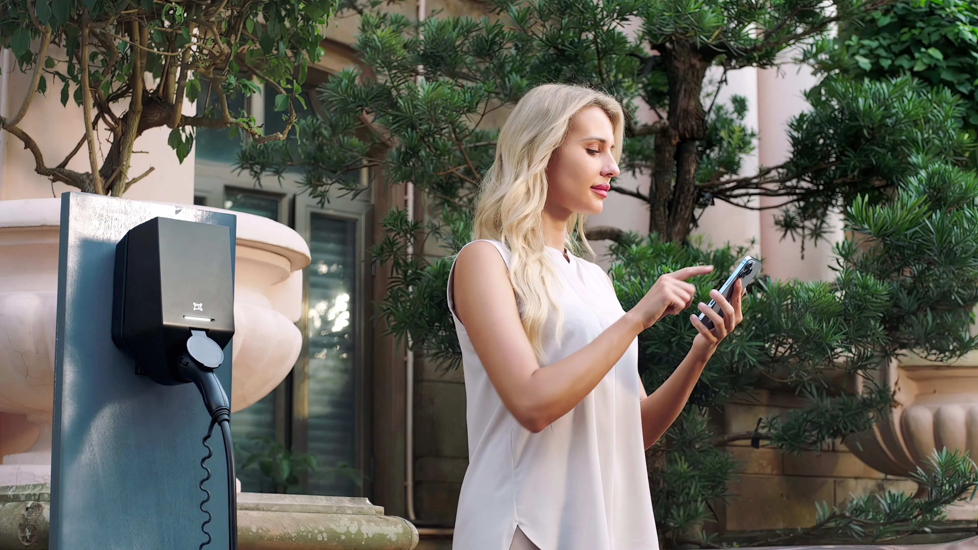 Driver using the Plugchoice app next to One Business