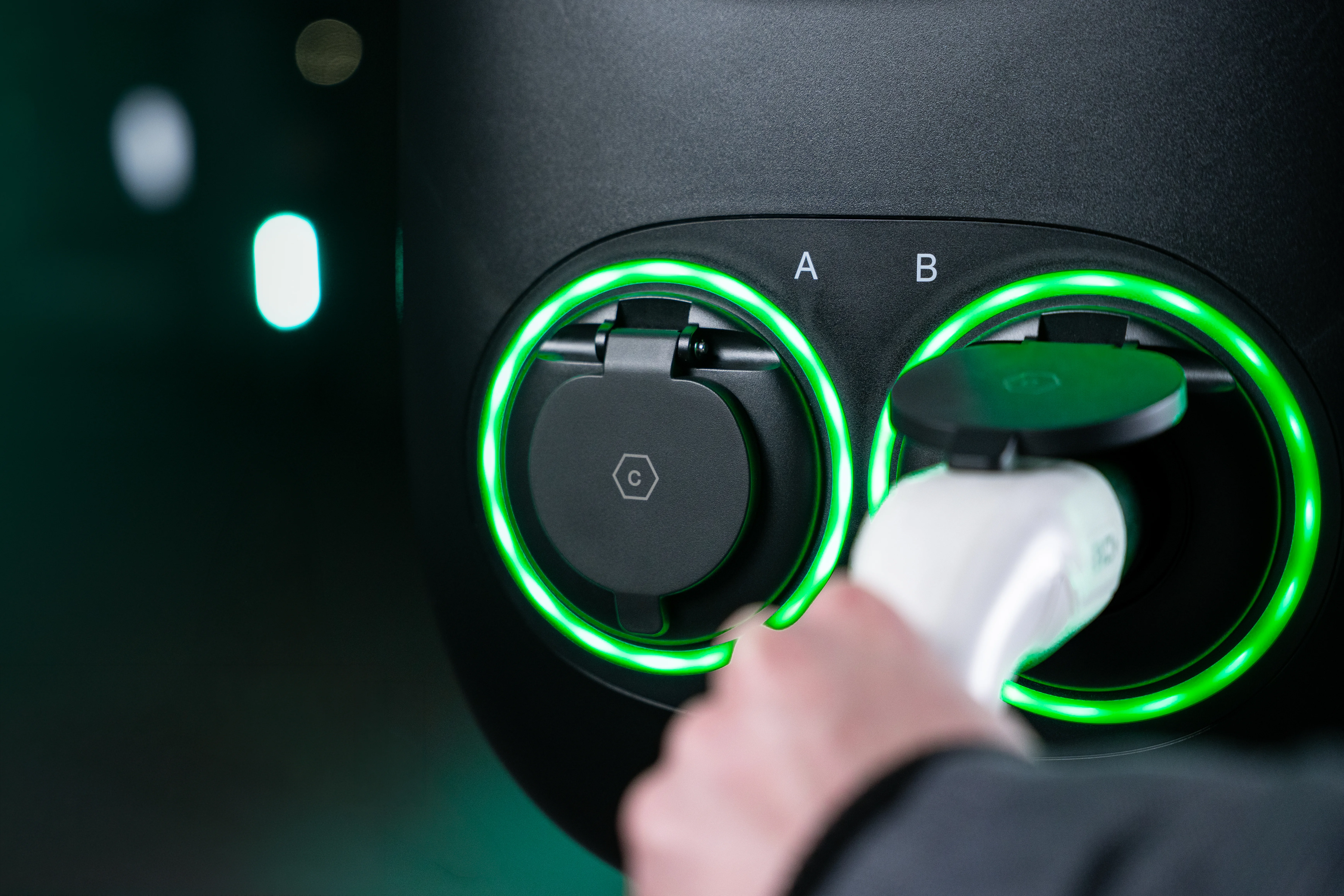 Hand plugging cable into Two Pro