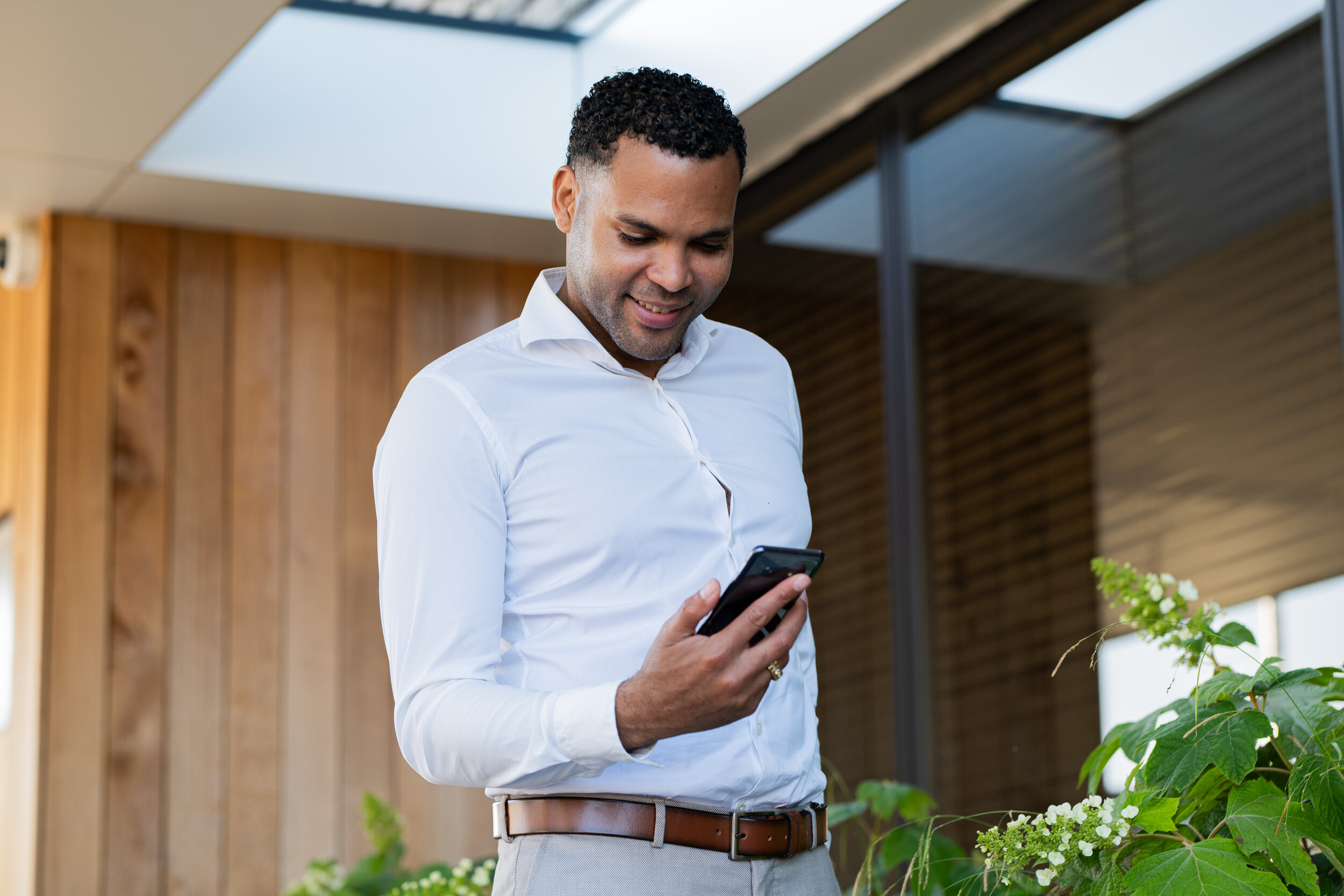 Happy EV owner checking the app
